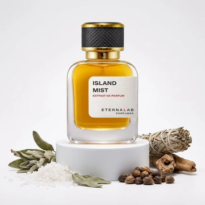 Eterna Lab Island Mist Extrait de Parfum bottle displayed with fresh sage, sea salt crystals, driftwood, and earthy seeds.