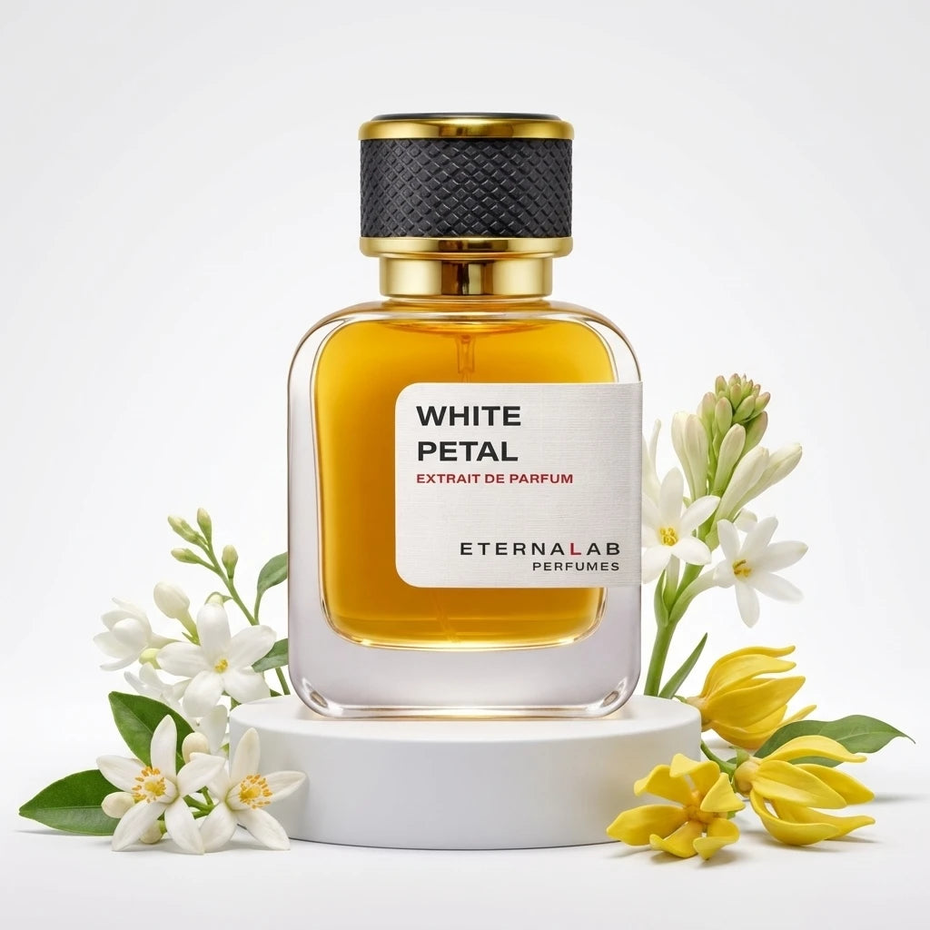 Eterna Lab White Petal Extrait de Parfum bottle surrounded by white tuberose, orange blossom, and yellow ylang-ylang flowers.